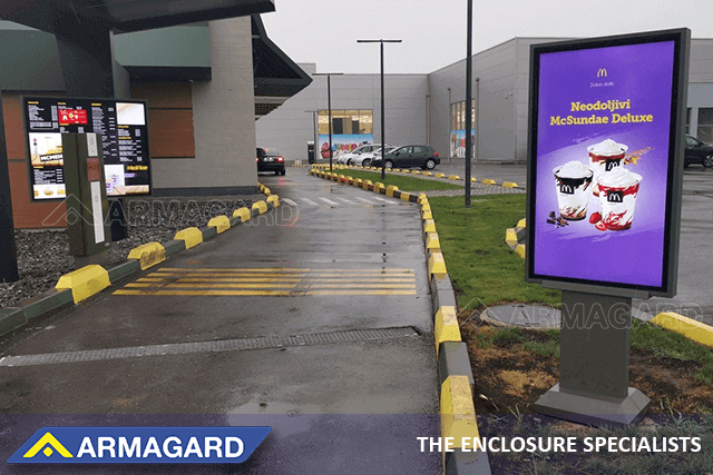 A McDonald's drive thru in Serbia with a single-screen, Samsung OH55F outdoor digital menu board