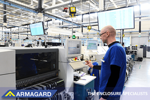 A factory worker using displays with industrial TV screen protection